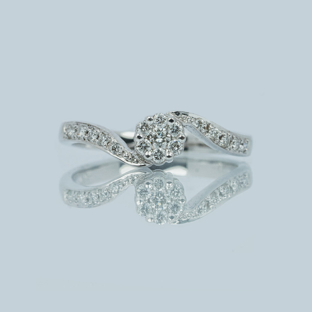 18 carat white gold and diamond cluster engagement ring