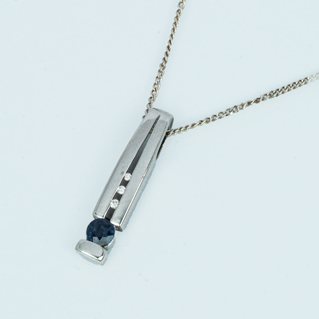 18 carat white gold sapphire and diamond bar pendant