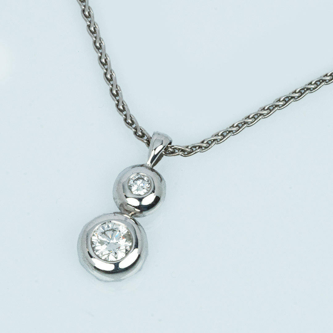18 carat white gold diamond double bezel set solitaire pendant