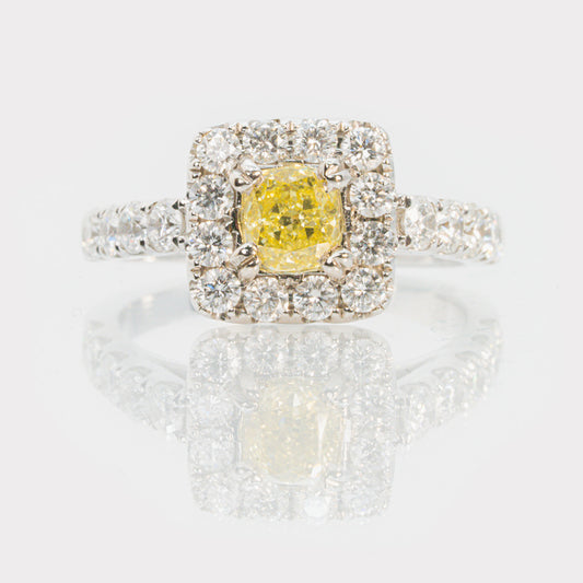18 carat white gold cushion cut yellow diamond with white diamond halo