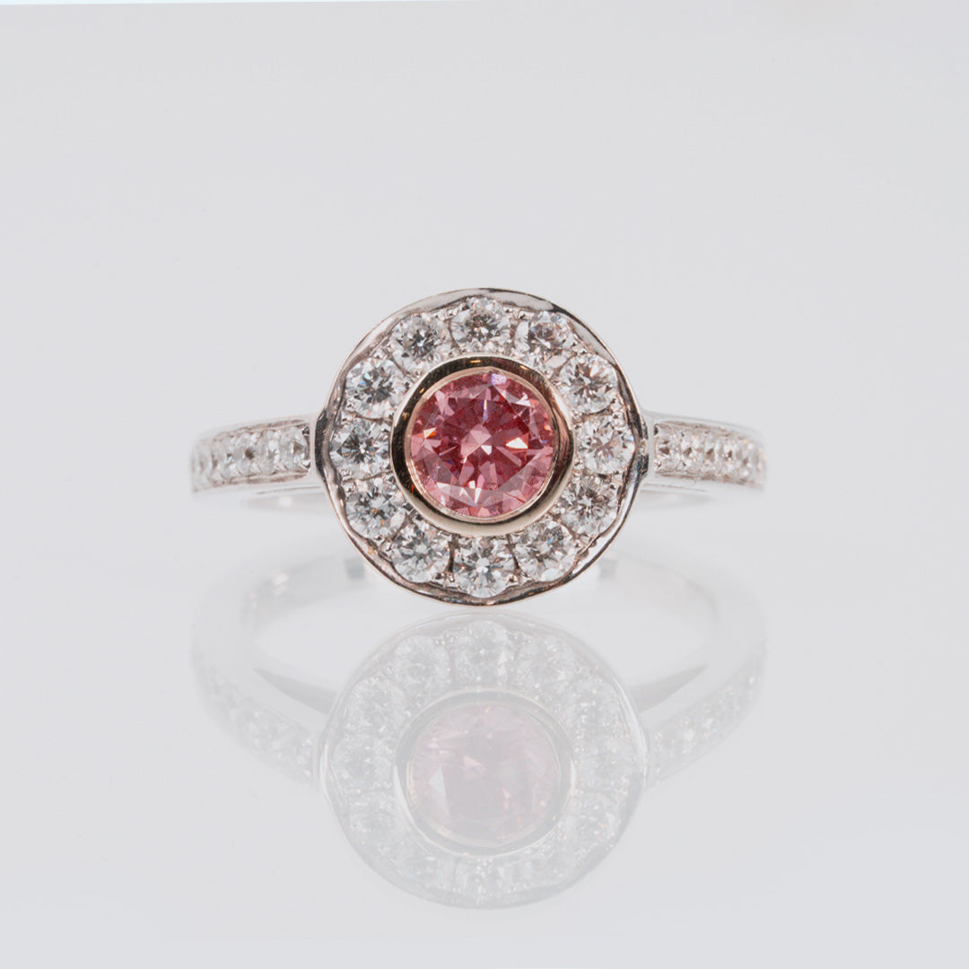 18 carat white gold lab grown pink and white diamond halo and band engagement ring